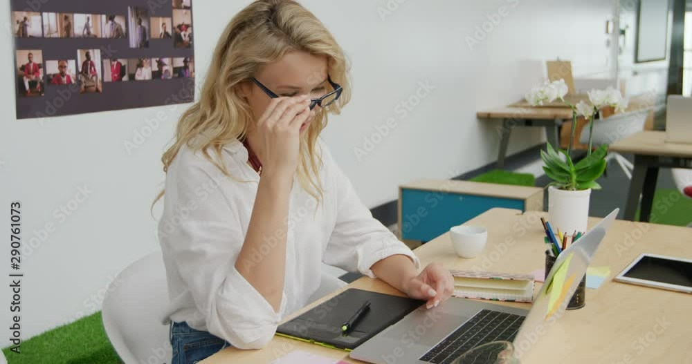 Young woman working in a creative office Young woman working in a creative office