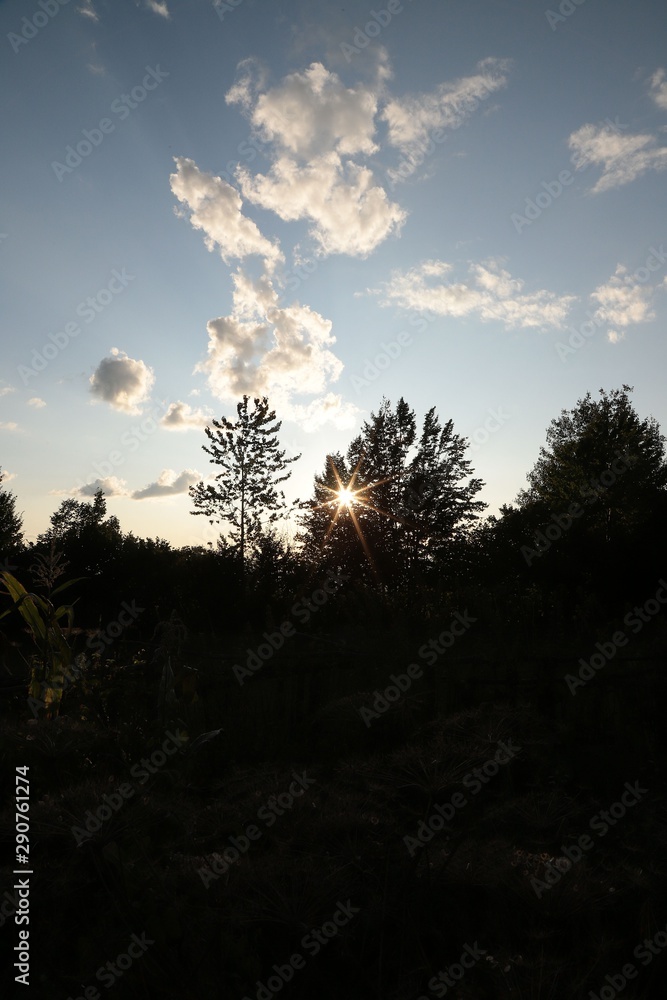 Happy family together, parents with their little child at sunset