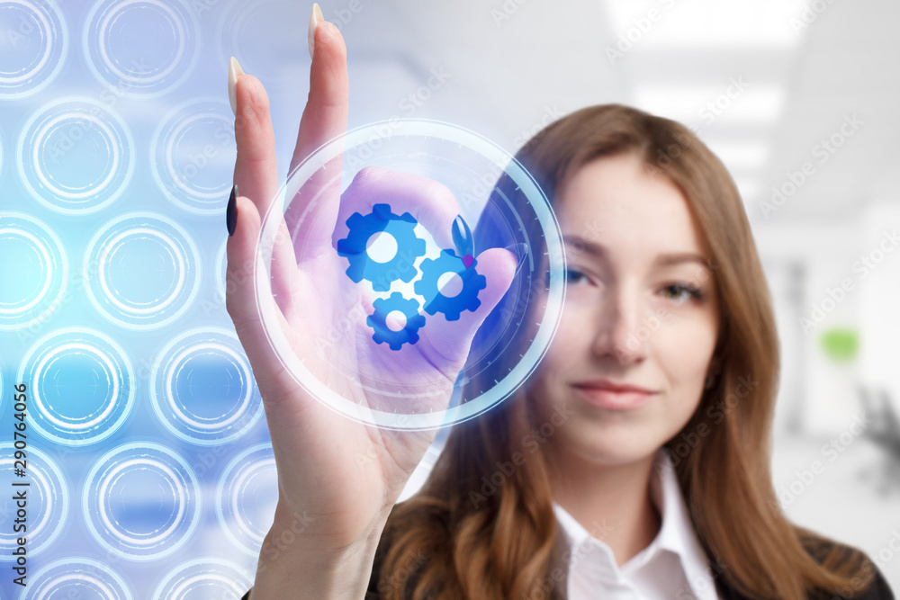 The concept of business, technology, the Internet and the network. A young entrepreneur working on a virtual screen of the future and sees the inscription: The concept of business, technology, the Internet and the network. A young entrepreneur working on a virtual screen of the future and sees the inscription: