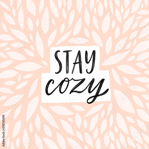 Stay cozy Hand written lettering quote. Cozy phrase for winter or autumn time. Modern calligraphy poster. Minimalist sign. Pastel pink colors and abstract decoration.