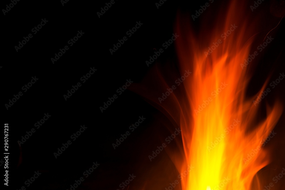 Red and orange fire flames isolated on black background, spooky shapes, large copy space Red and orange fire flames isolated on black background, spooky shapes, large copy space