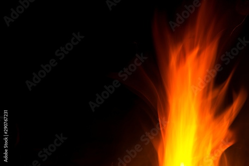 Red and orange fire flames isolated on black background, spooky shapes, large copy space © josefkubes