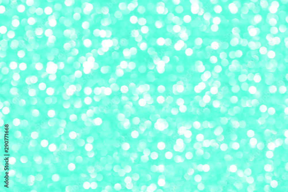 Modern beautiful holographic background of holiday lights bokeh in trendy mint color. Wallpaper design.
