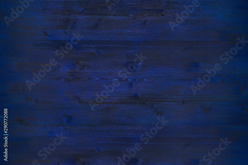 Fototapeta Naklejka Na Ścianę i Meble -  Dark grunge wooden background. Pine wood colored in dark blue, wood texture and knots preserved