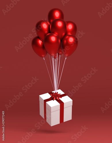 gift hanging on balloons, red background
