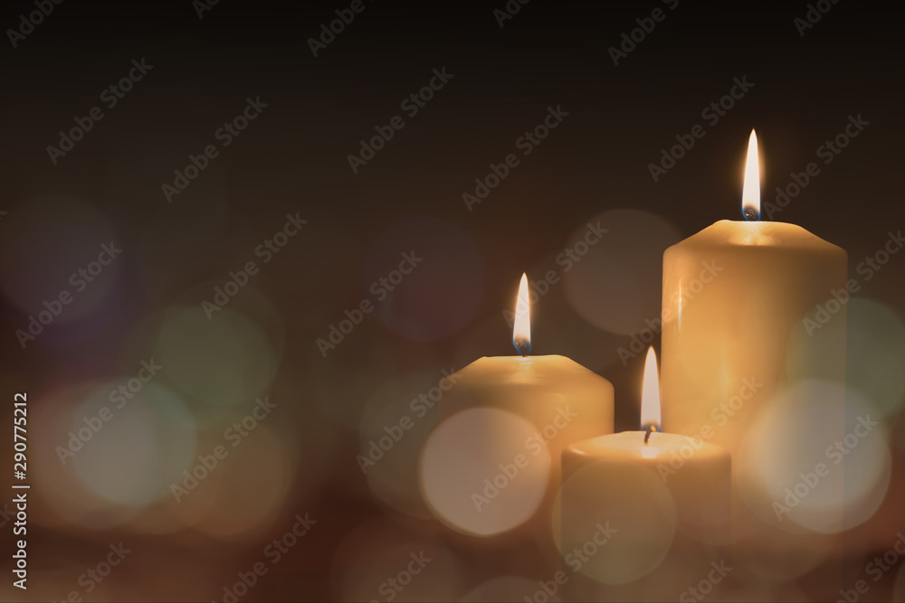 Christmas advent candle light in church with blurry golden bokeh for religious ritual or spiritual zen meditation, peaceful mind and soul Christmas advent candle light in church with blurry golden bokeh for religious ritual or spiritual zen meditation, peaceful mind and soul