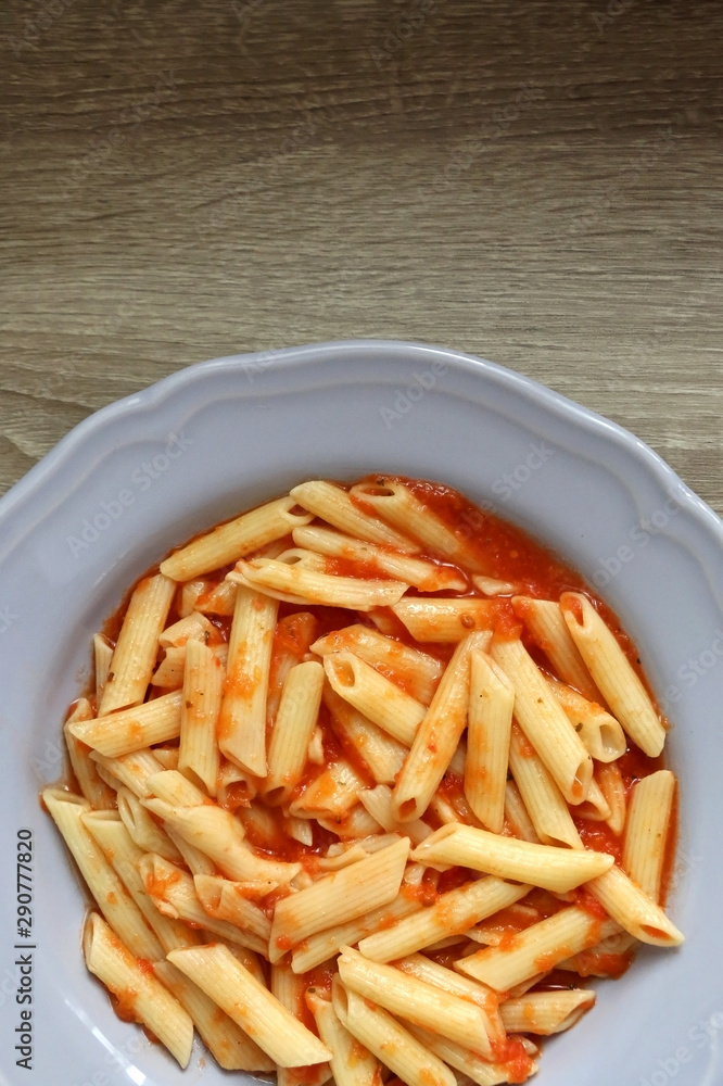 Plate of pasta with homemade tomato sauce. Flat lay. Plate of pasta with homemade tomato sauce. Flat lay.