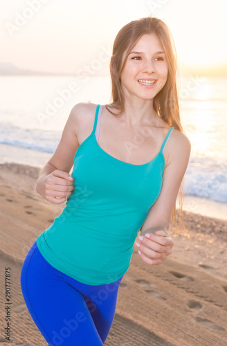 Female in blue T-shirt is jogging © JackF