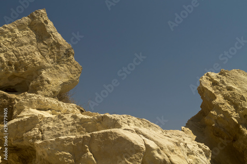 White mountain rocks in front of blue sky 