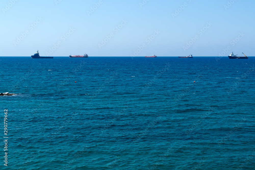 Panorama of blue sea with ships on horizon
