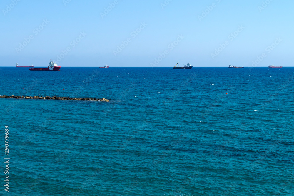 Panorama of blue sea with ships on horizon