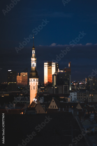 Night cityscape of old Tallinn,Estonia, medieval and modern buildings with illumination