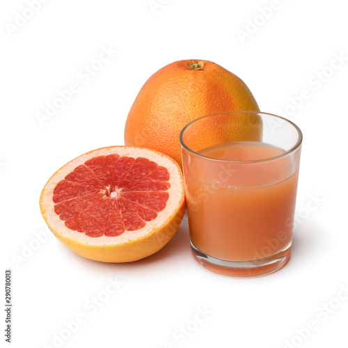 Whole and halved red grapefruit