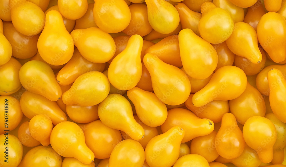 small yellow tomatoes of unusual shape background small yellow tomatoes of unusual shape background