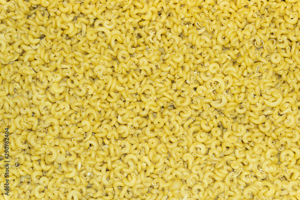 Italian pasta background. A large amount of fine pasta Italian pasta background. A large amount of fine pasta