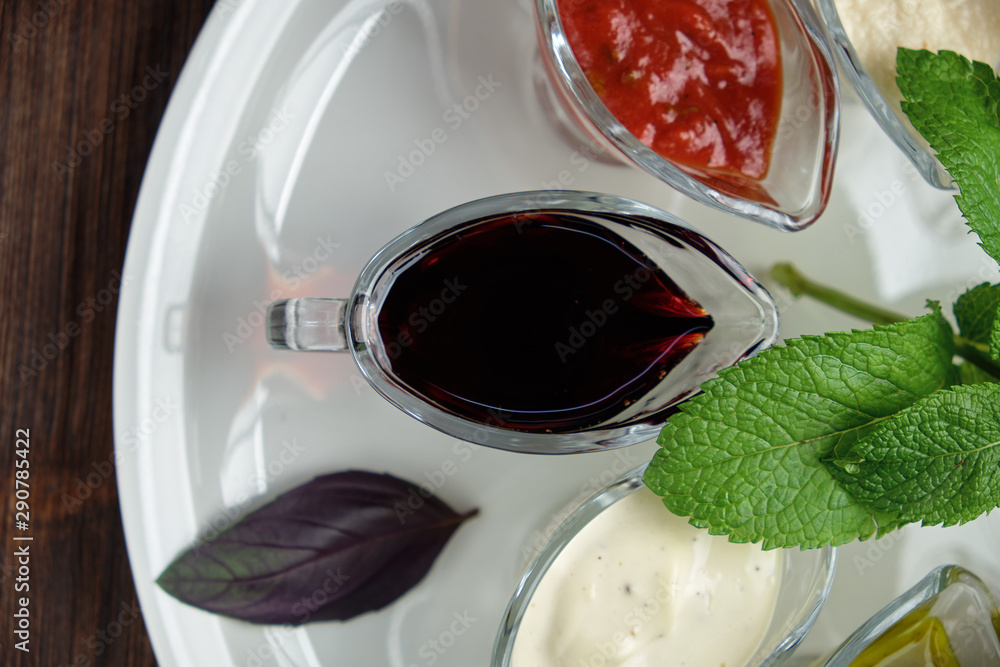 sauces in bowls on a dark wooden background. menu for catering sauces in bowls on a dark wooden background. menu for catering