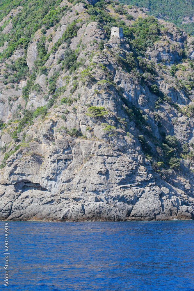 Camogli coast, little tower on the top of rocky cliff, Liguria, Italy