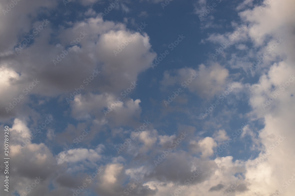the endless distance of the clouds, like cotton candy, in the rays of the bright sun hiding behind them. the endless distance of the clouds, like cotton candy, in the rays of the bright sun hiding behind them.
