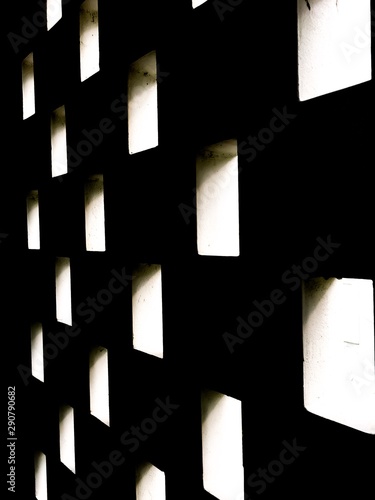 Light penetrates through the concrete wall.