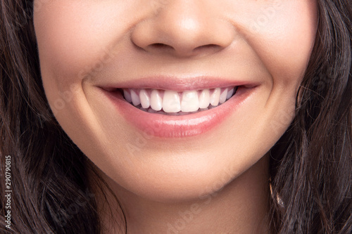 Fotografie Closeup smile of young teen happy female woman great white teeth