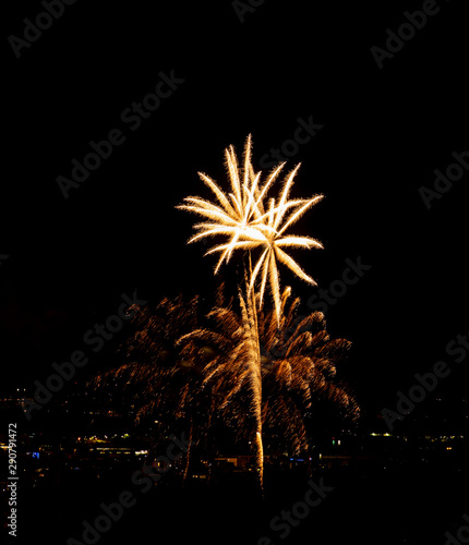 Fireworks display over small city