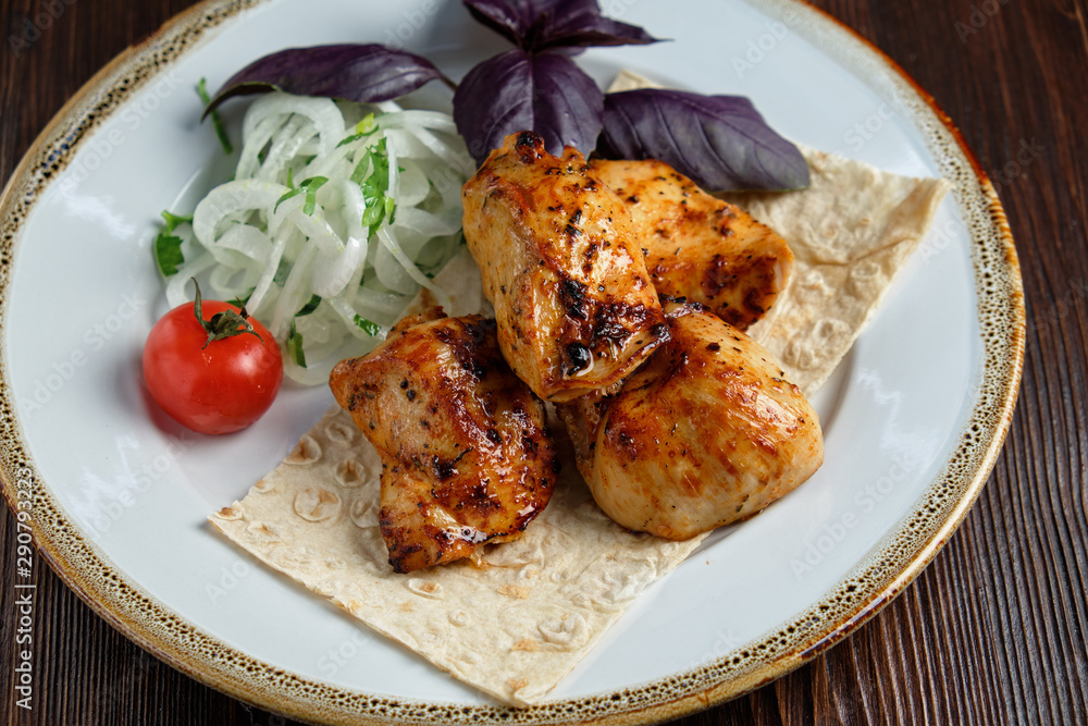 Skewers of chicken with thin pita bread . catering menu Skewers of chicken with thin pita bread . catering menu