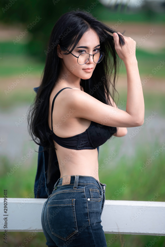 Portrait of sexy asian woman wear black bra on the field,Thailand people  take a picture Stock Photo | Adobe Stock