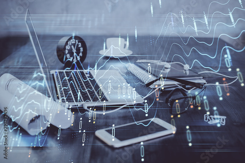 Forex Chart hologram on table with computer background. Double exposure. Concept of financial markets.