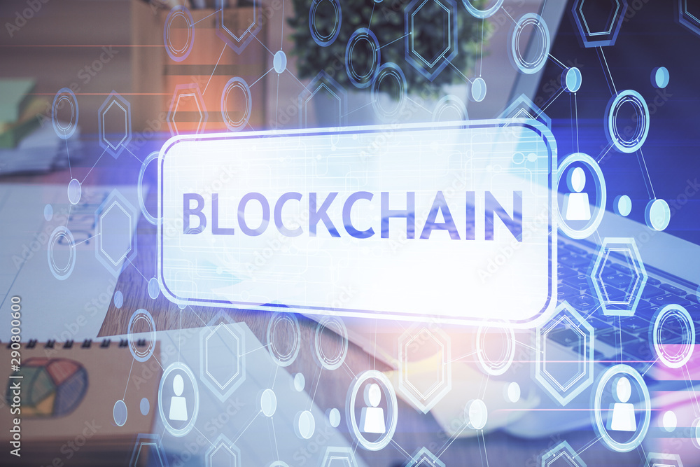 Multi exposure of blockchain theme hologram and table with computer background. Concept of bitcoin crypto currency. Multi exposure of blockchain theme hologram and table with computer background. Concept of bitcoin crypto currency.