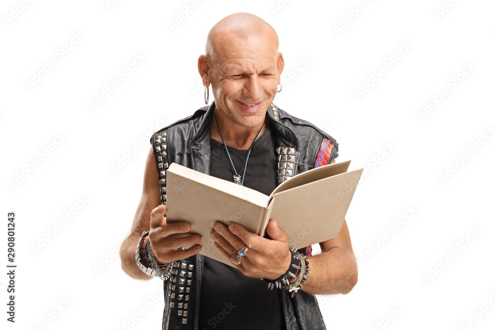 Punker in leather vest reading a book Punker in leather vest reading a book