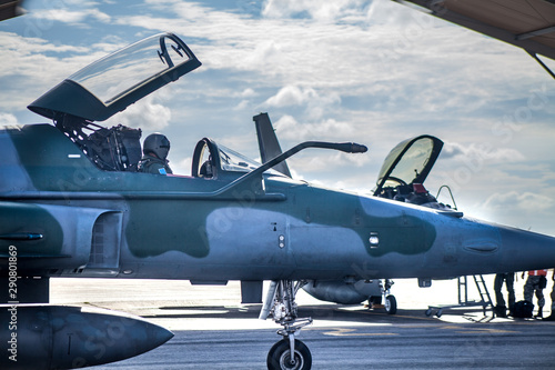Fighter jet on the runway with pilot preparing for takeoff