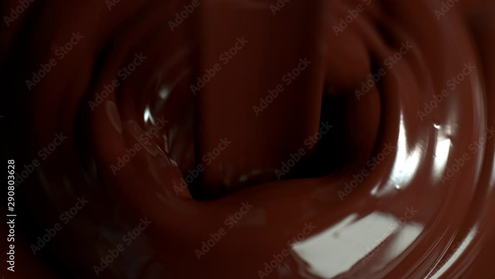 Super Slow Motion Shot of Pouring Meldet Chocolate at 1000fps. Shooted with High Speed Cinema Camera. Super Slow Motion Shot of Pouring Meldet Chocolate at 1000fps. Shooted with High Speed Cinema Camera.