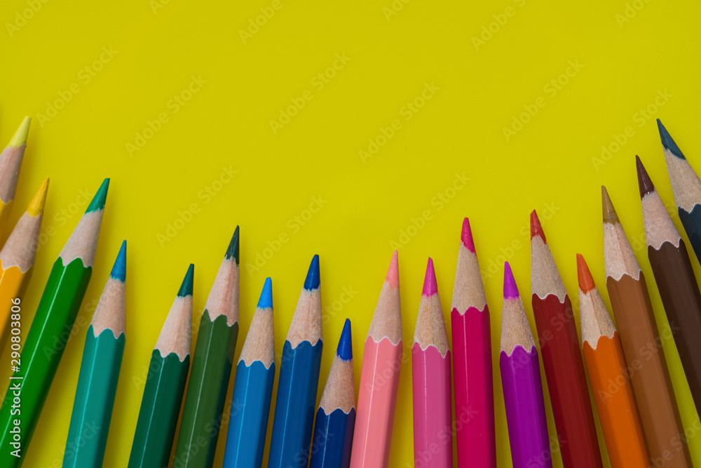 Color pencils isolated on yellow background.Close up. Color pencils isolated on yellow background.Close up.