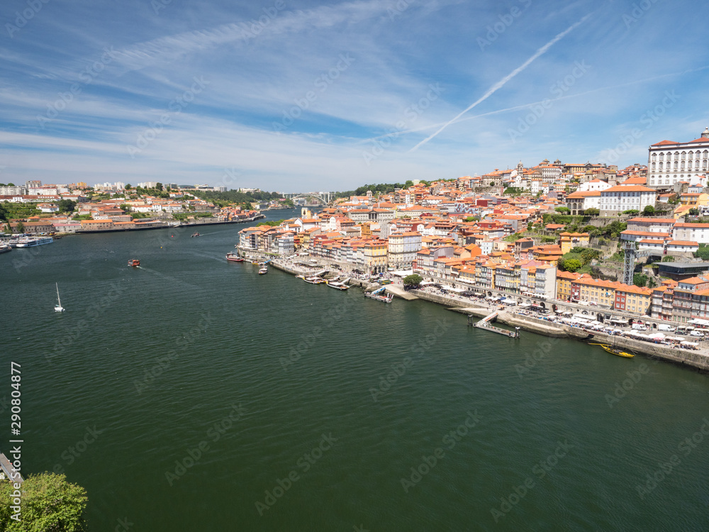 Portugal, may 2019: Panorama from famous bridge Ponte dom Luis above Old town Porto and river Duoro at sunny summer day