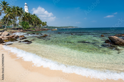Lighthouse and beautiful beach landscape in Sri Lanka © surangaw