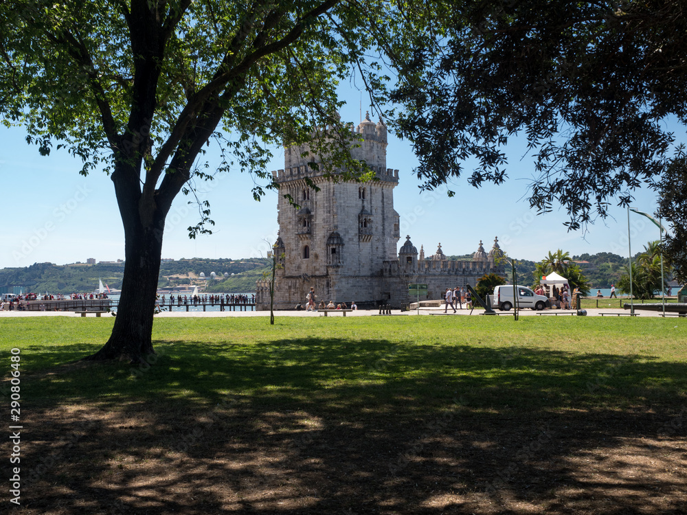 Portugal, may 2019: Scenic Belem Tower and wooden bridge miroring with low tides on Tagus River. Torre de Belem is Unesco Heritage and icon of Lisbon and the most visited attraction in Lisbon