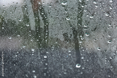 Wallpaper Mural Raindrops on glass, selective focus and blurred background. Autumn concept with rain drops on the car window. Transparent drop of water on the glass. Wet car windshield in rainy autumn weather  Torontodigital.ca