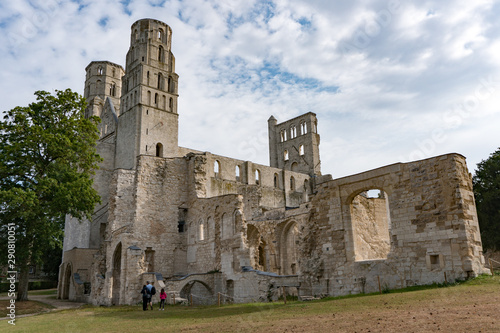 tourists visit the ruins of the old abbey and Benedictine monastery at Jumieges in Normandy in France photo