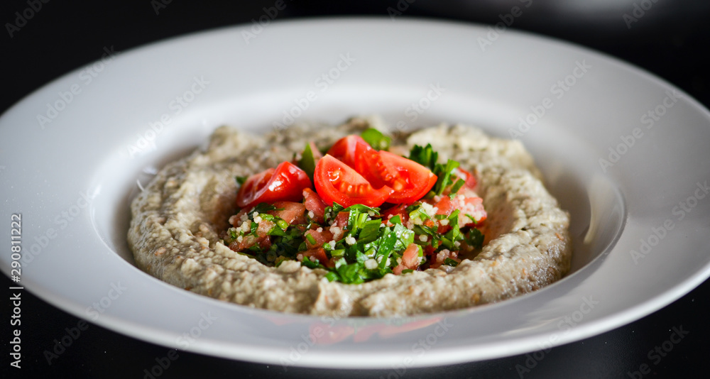 lebanese hummus dish with fresh vegetables, beef meat & pomegranate seeds lebanese hummus dish with fresh vegetables, beef meat & pomegranate seeds