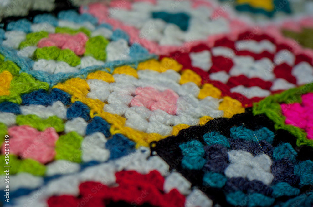 Detail of colorful blanket crochet with granny squares