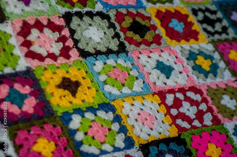 Detail of colorful blanket crochet with granny squares