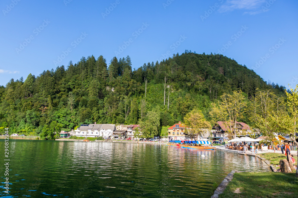  Guests and residents of Bled relax on the lake