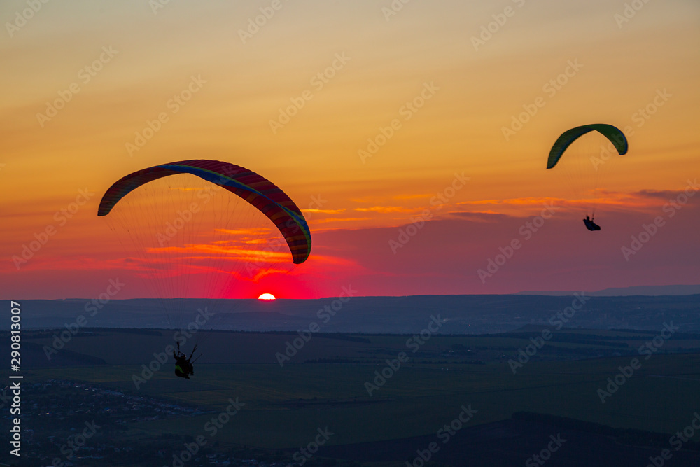 Paragliders and sunset. Mineralnye Vody resort. Russia Paragliders and sunset. Mineralnye Vody resort. Russia