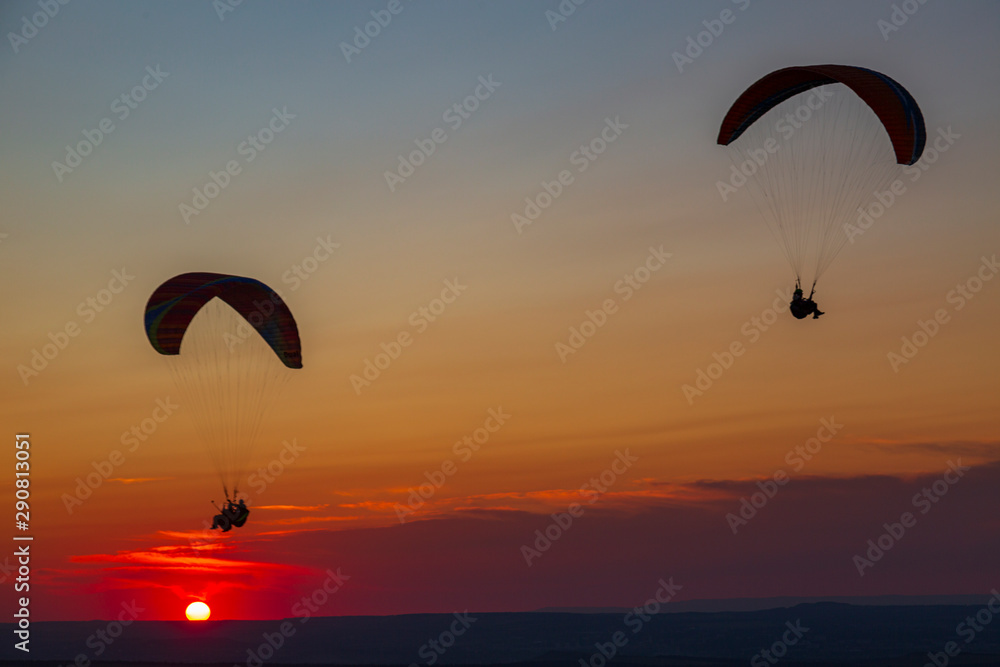 Paragliders and sunset. Mineralnye Vody resort. Russia Paragliders and sunset. Mineralnye Vody resort. Russia