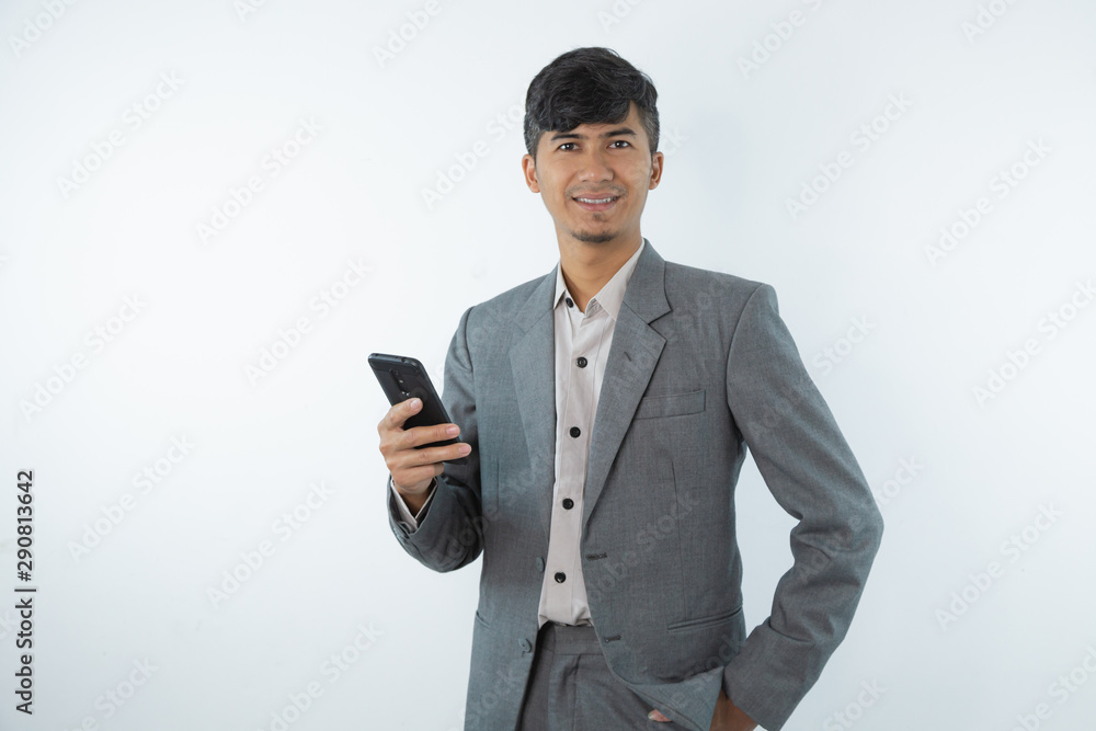 Portrait of asian young business man using smart cell phone isolated on white background. Portrait of asian young business man using smart cell phone isolated on white background.