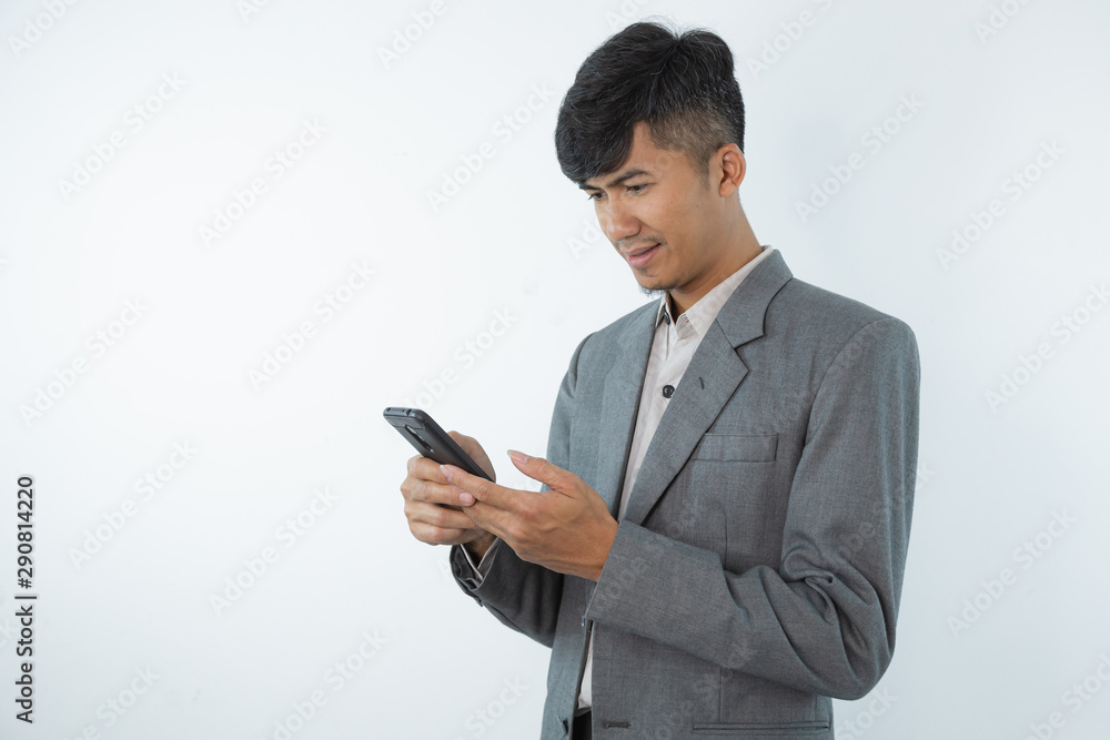 Portrait of asian young business man using smart cell phone isolated on white background. Portrait of asian young business man using smart cell phone isolated on white background.