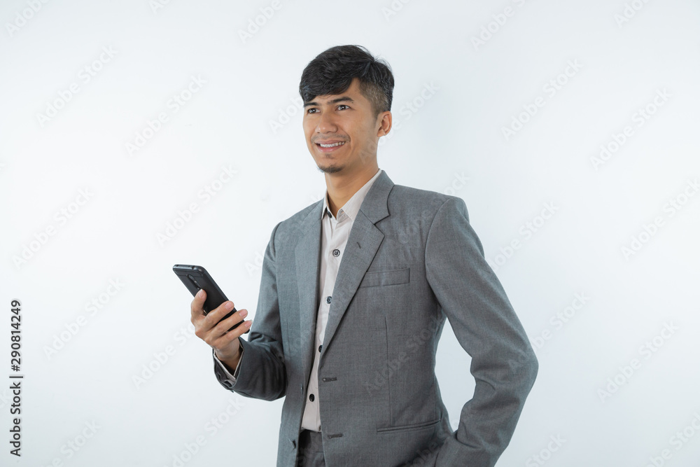 Portrait of asian young business man using smart cell phone isolated on white background. Portrait of asian young business man using smart cell phone isolated on white background.