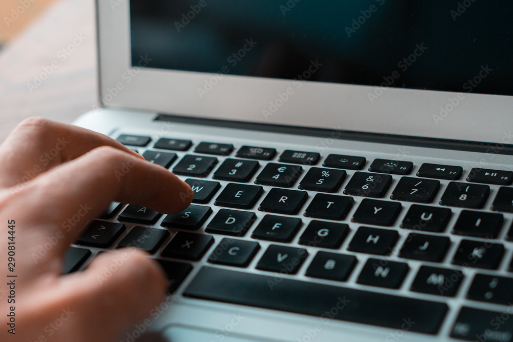 Close up hand typing on laptop Close up hand typing on laptop