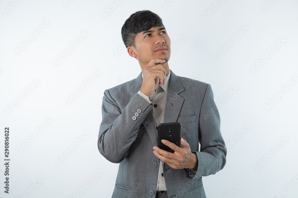 Young business asian man thinking of an idea isolated on white background. Young business asian man thinking of an idea isolated on white background.