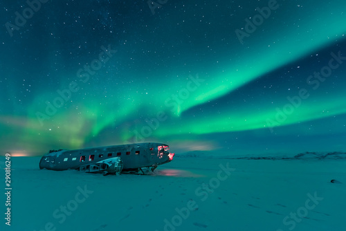 Northern lights over plane wreckage in iceland